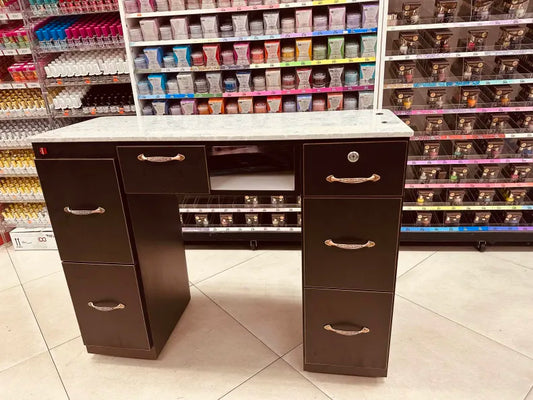 Modern manicure table with marble surface.